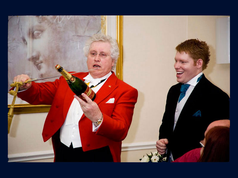 Ken Chaproniere Toastmaster demonstrating Sabrage at a wedding